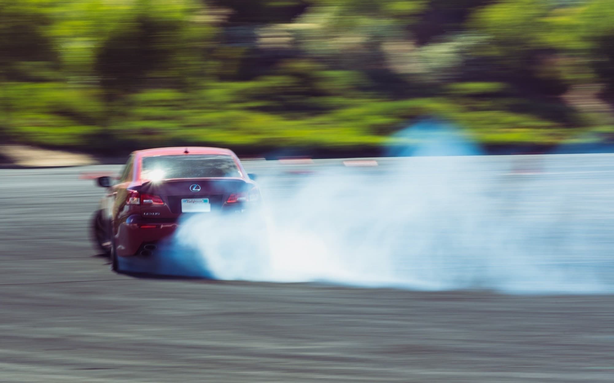 Track car sliding through a corner at a California track day
